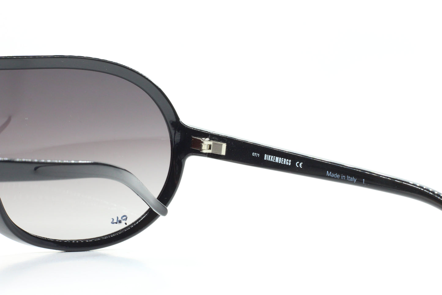 Close-up of Bikkembergs BK54602 designer sunglasses with black gradient lenses and sleek black frame