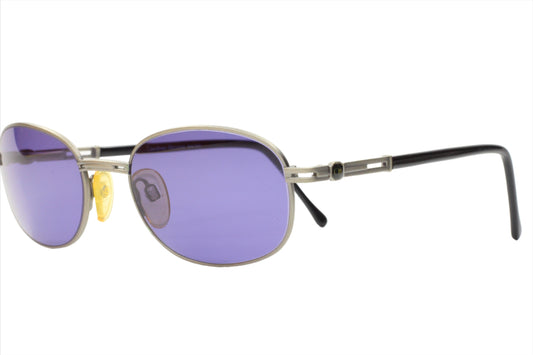 CH804 PD520 Carolina Herrera sunglasses by ABC Optical with purple lenses and metal frame
