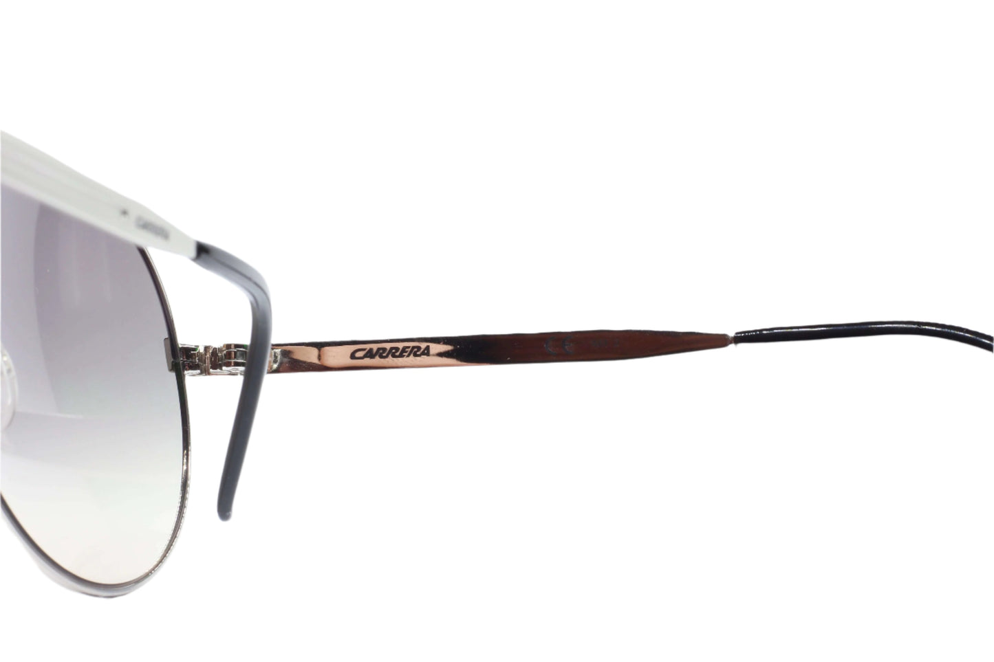 Close-up of designer aviator sunglasses online featuring thin metal frame and gradient lenses