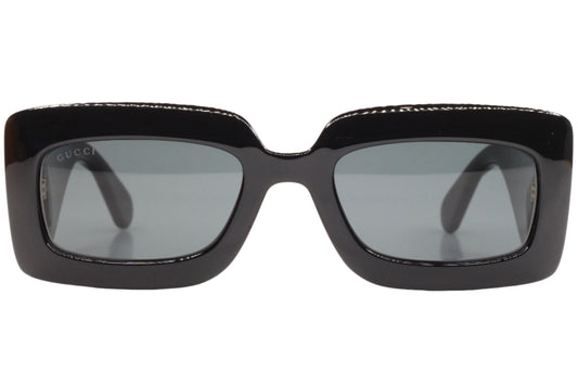 Front view of Gucci GG0811S sunglasses with black rectangular frames and gray lenses