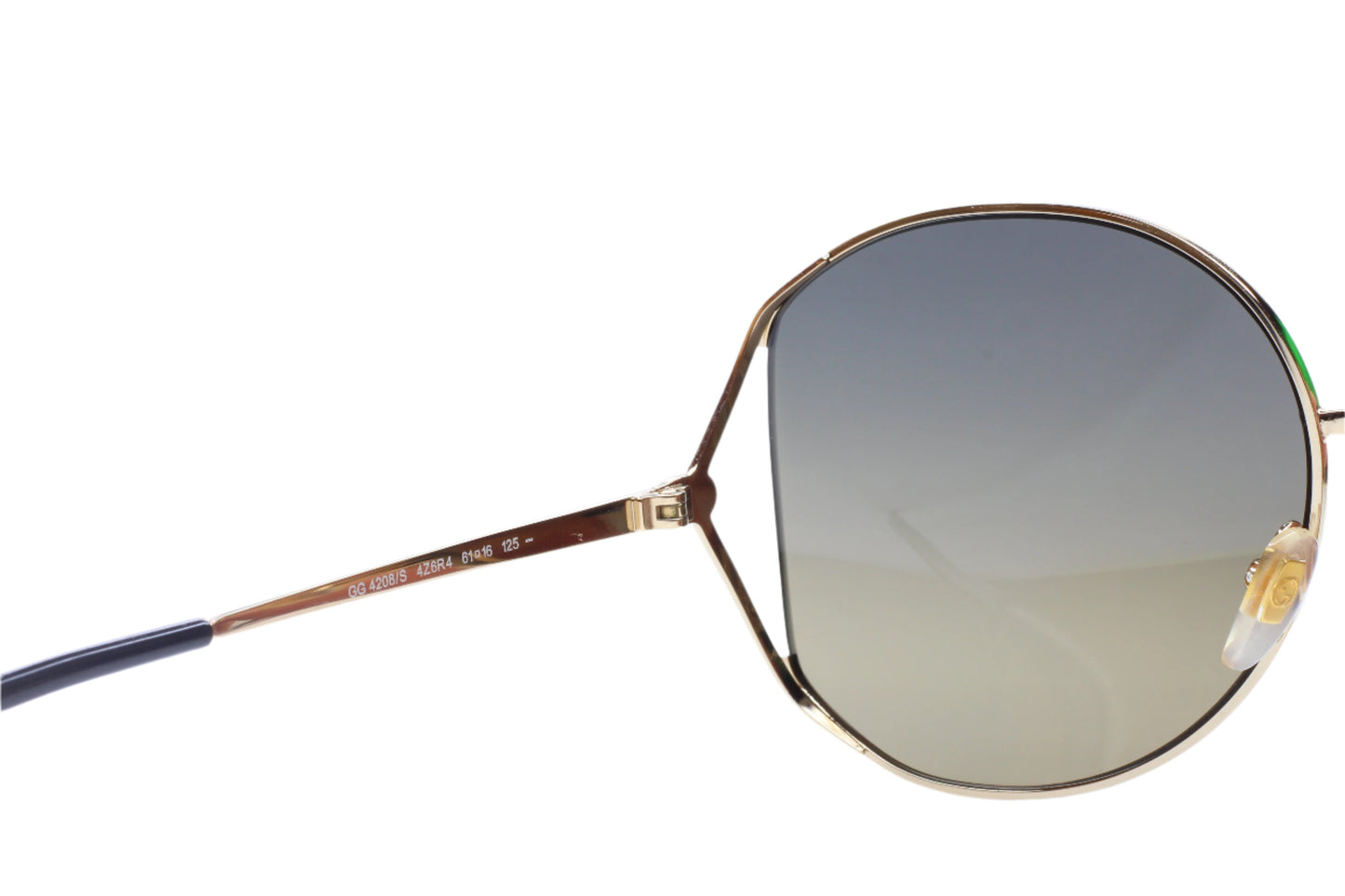 Gucci gold metal sunglasses women with round gradient lenses and thin frame by ABC Optical
