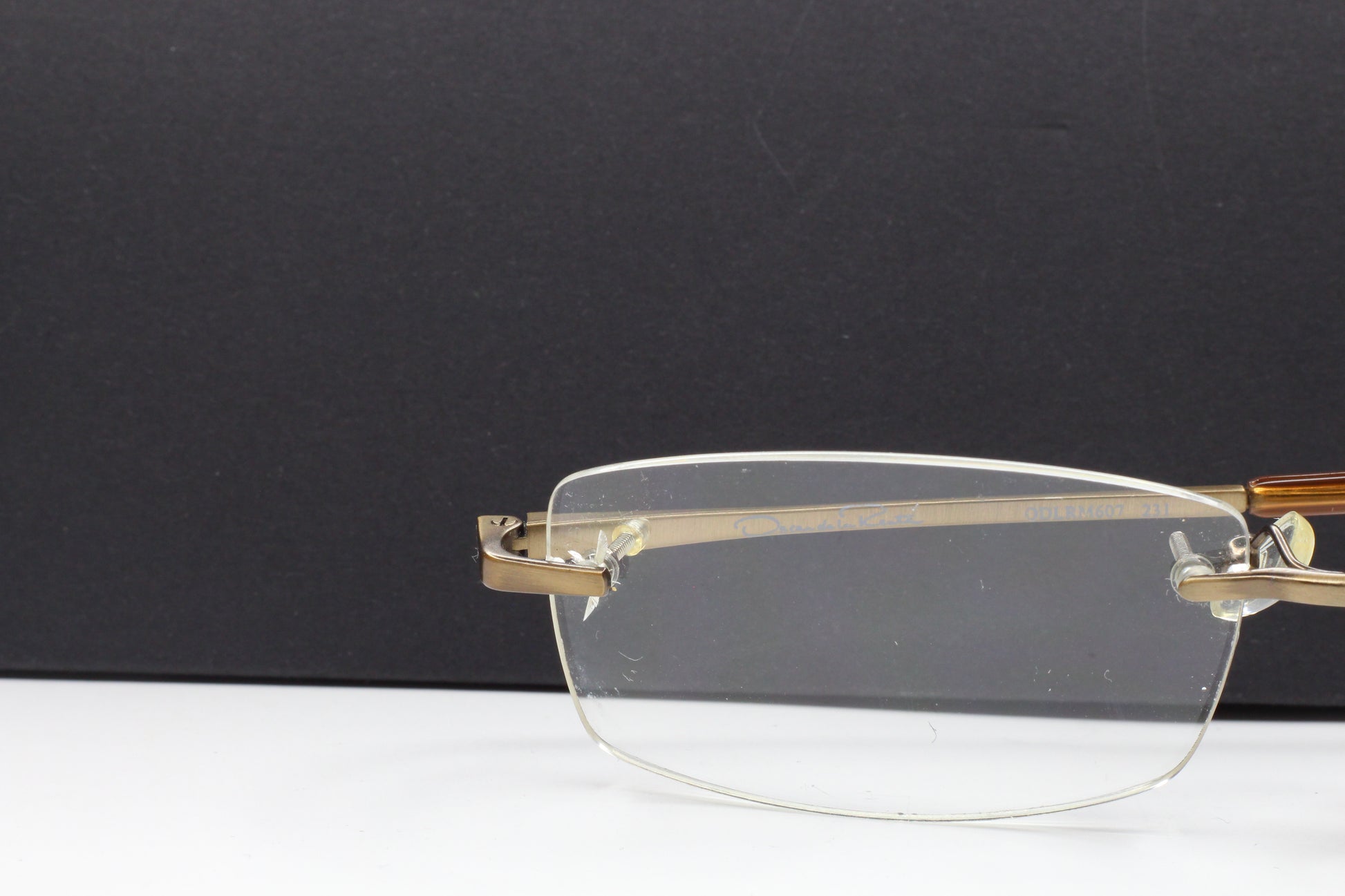 OSCAR DE LA RENTA OSL607 231 Brown Rimless Eyeglasses Optical Frames ABC Optical Eyeglasses