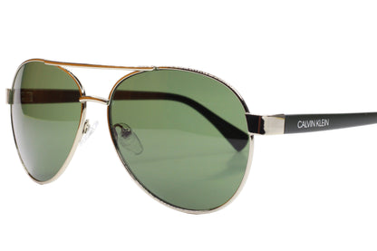 Aviator sunglasses with silver frame and green lenses on a white background