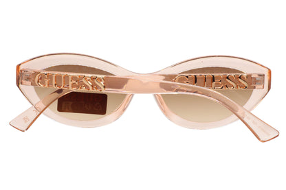 Guess sunglasses with a rose gold frame on a white  background