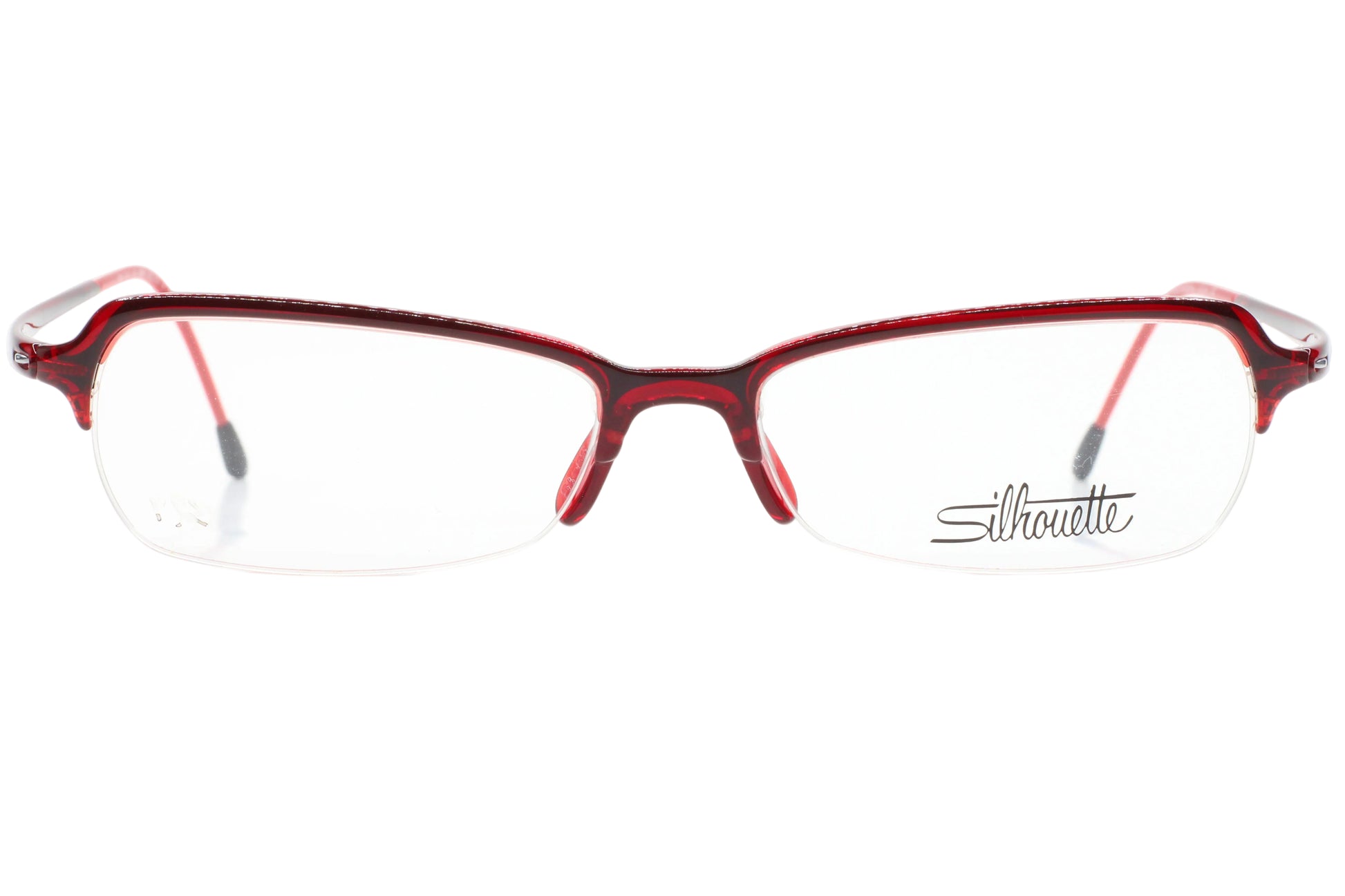 Red eyeglasses with 'Silhouette' logo on a white background