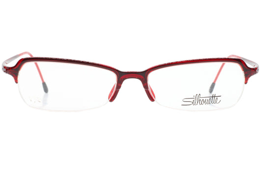 Red eyeglasses with 'Silhouette' logo on a white background