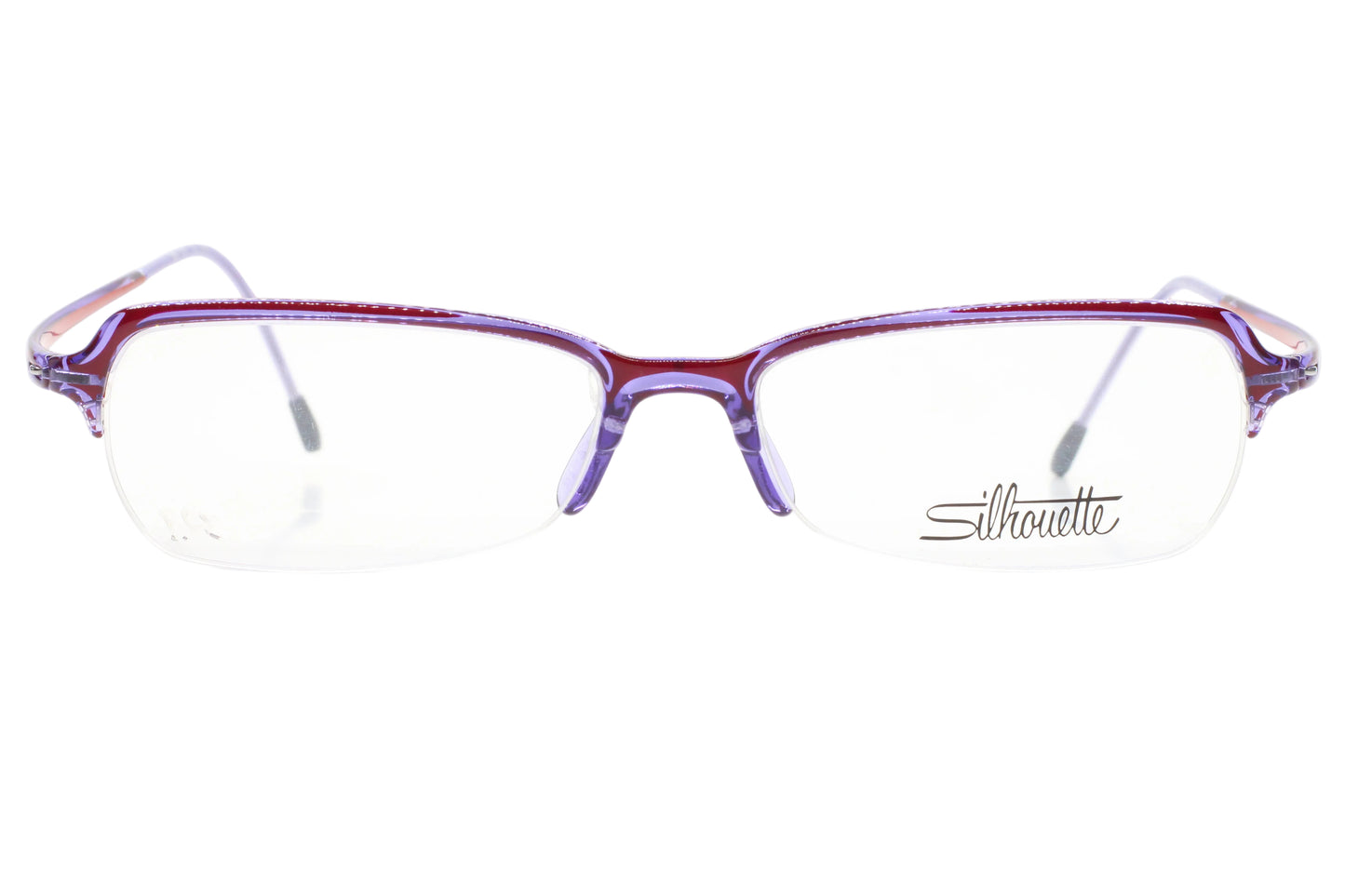 Purple eyeglasses on a white background with 'Silhouette' branding.