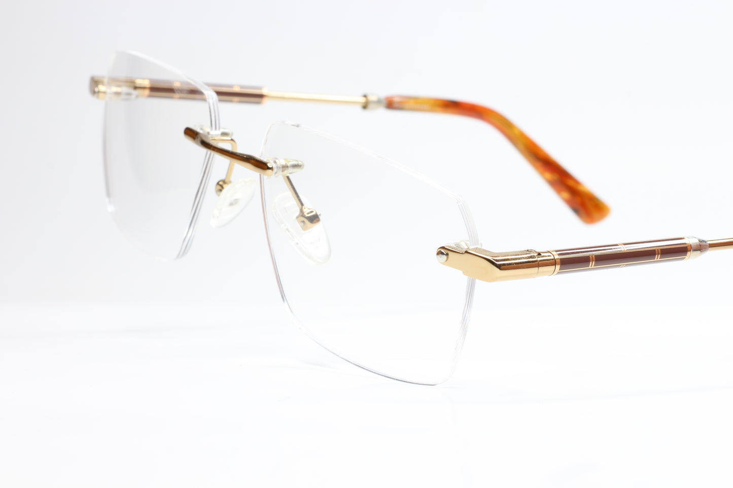 Myriad Eyewear ME25626 Gold Tortoise Rimless Eyeglasses Optical Frames ABC Optical Eyeglasses