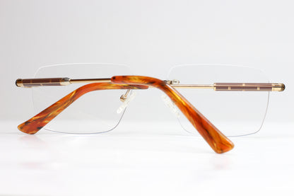 Myriad Eyewear ME25626 Gold Tortoise Rimless Eyeglasses Optical Frames ABC Optical Eyeglasses