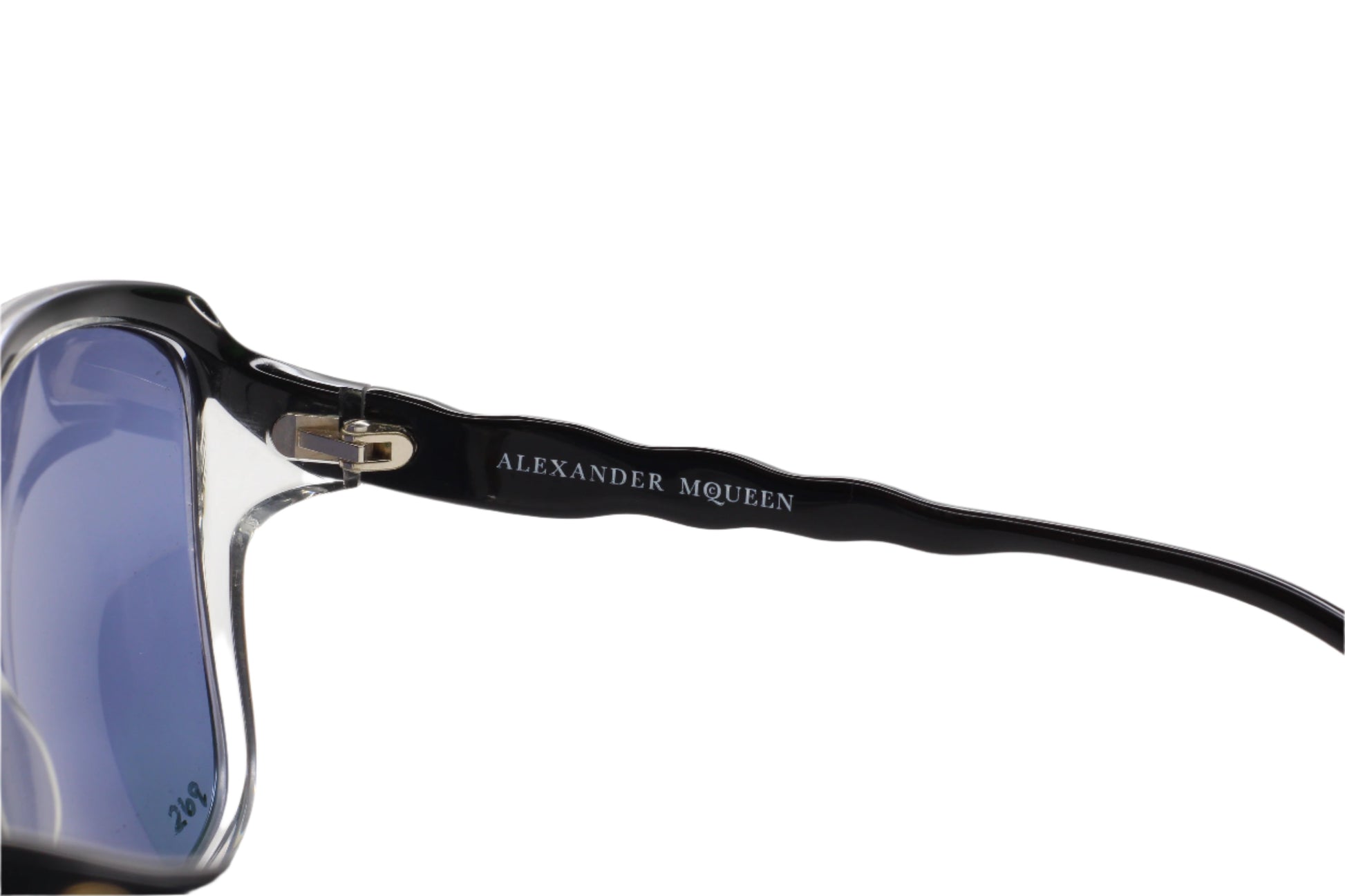 Close-up of Alexander McQueen designer black sunglasses online with glossy black frames and blue lenses