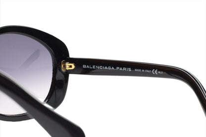 Close-up of black Balenciaga BAL0127S sunglasses online showing frame detail and branding