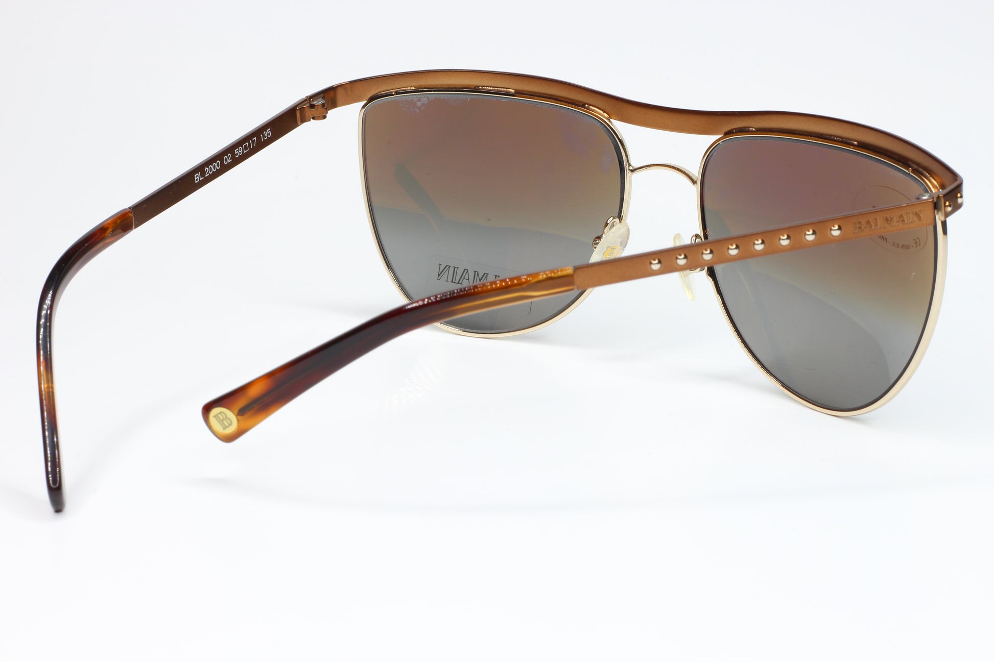 Balmain BL2000 02 sunglasses for sale with brown gradient lenses and gold frame by ABC Optical