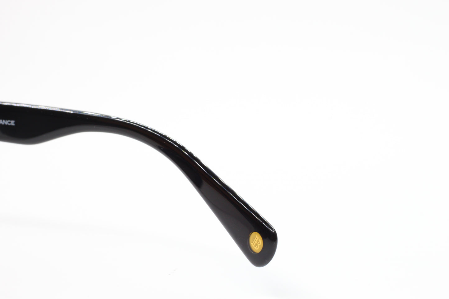 Close-up view of black temple arm detail of Balmain BL4002 sunglasses from ABC Optical
