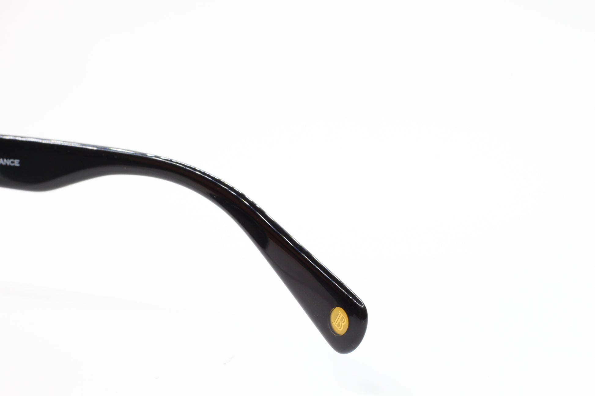 Close-up view of black temple arm detail of Balmain BL4002 sunglasses from ABC Optical