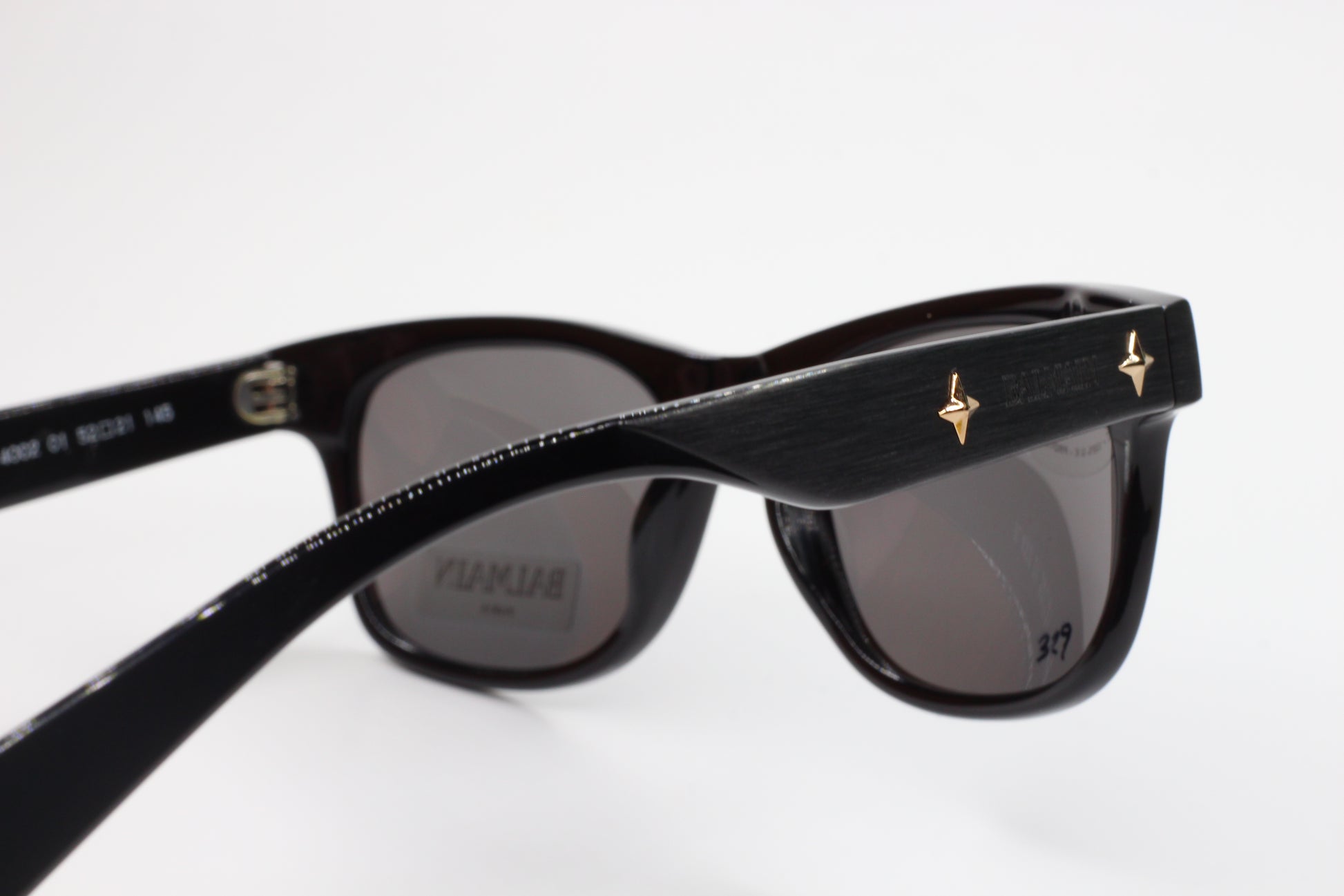 Balmain BL4002 sunglasses black optical frames with gold star accents from ABC Optical