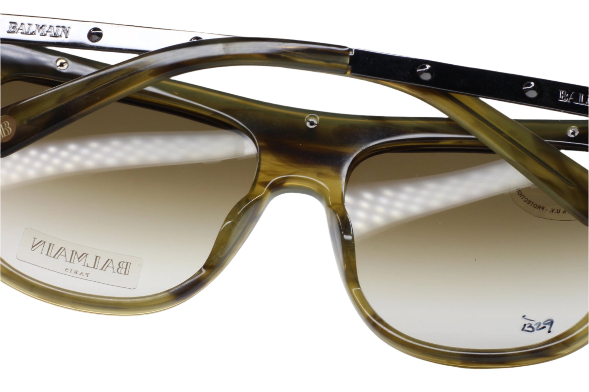 Balmain Paris khaki horn sunglasses with tinted lenses and durable khaki frames by ABC Optical