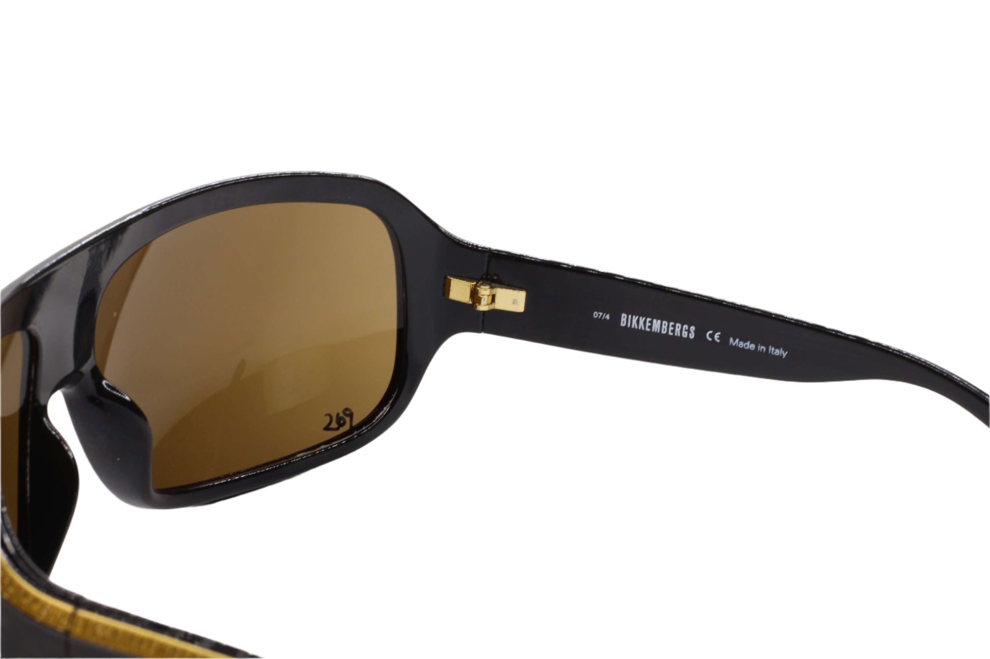 Close-up of Bikkembergs luxury sunglasses brown lenses and black frame by ABC Optical