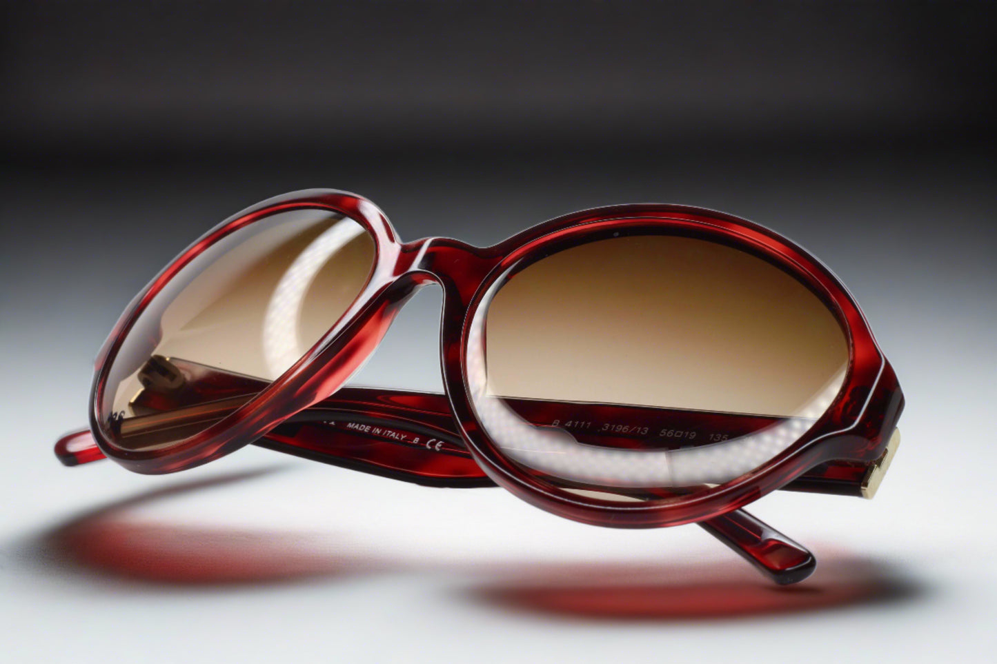 Burberry B4111 3196 13 sunglasses sale by ABC Optical with red oval frames and gradient brown lenses