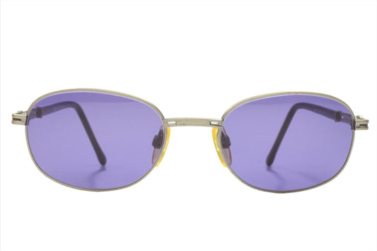 CH804 PD520 Carolina Herrera sunglasses with oval purple lenses and silver metal frames from ABC Optical