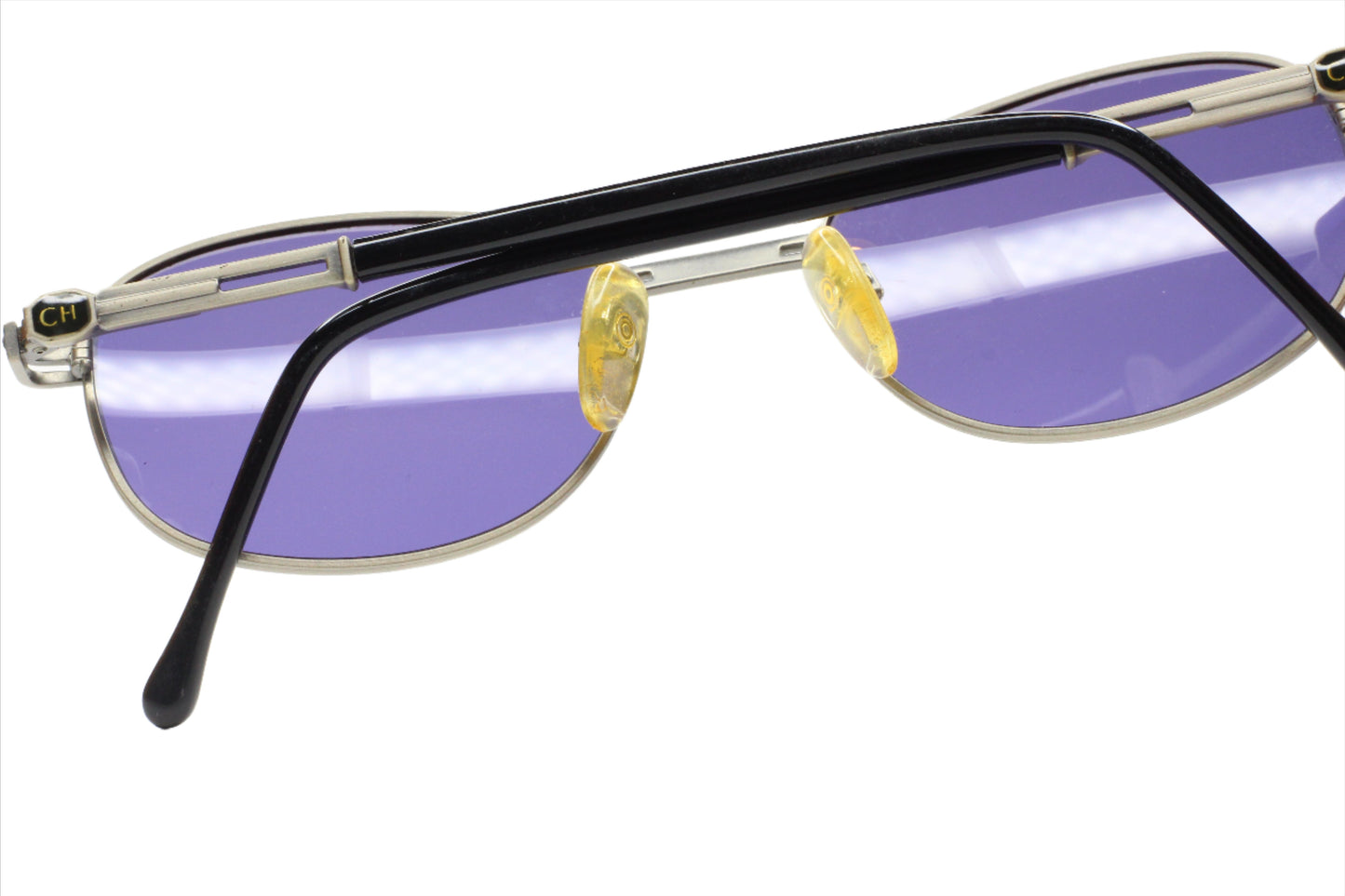 CH804 PD520 Carolina Herrera sunglasses with purple lenses and metal frame by ABC Optical
