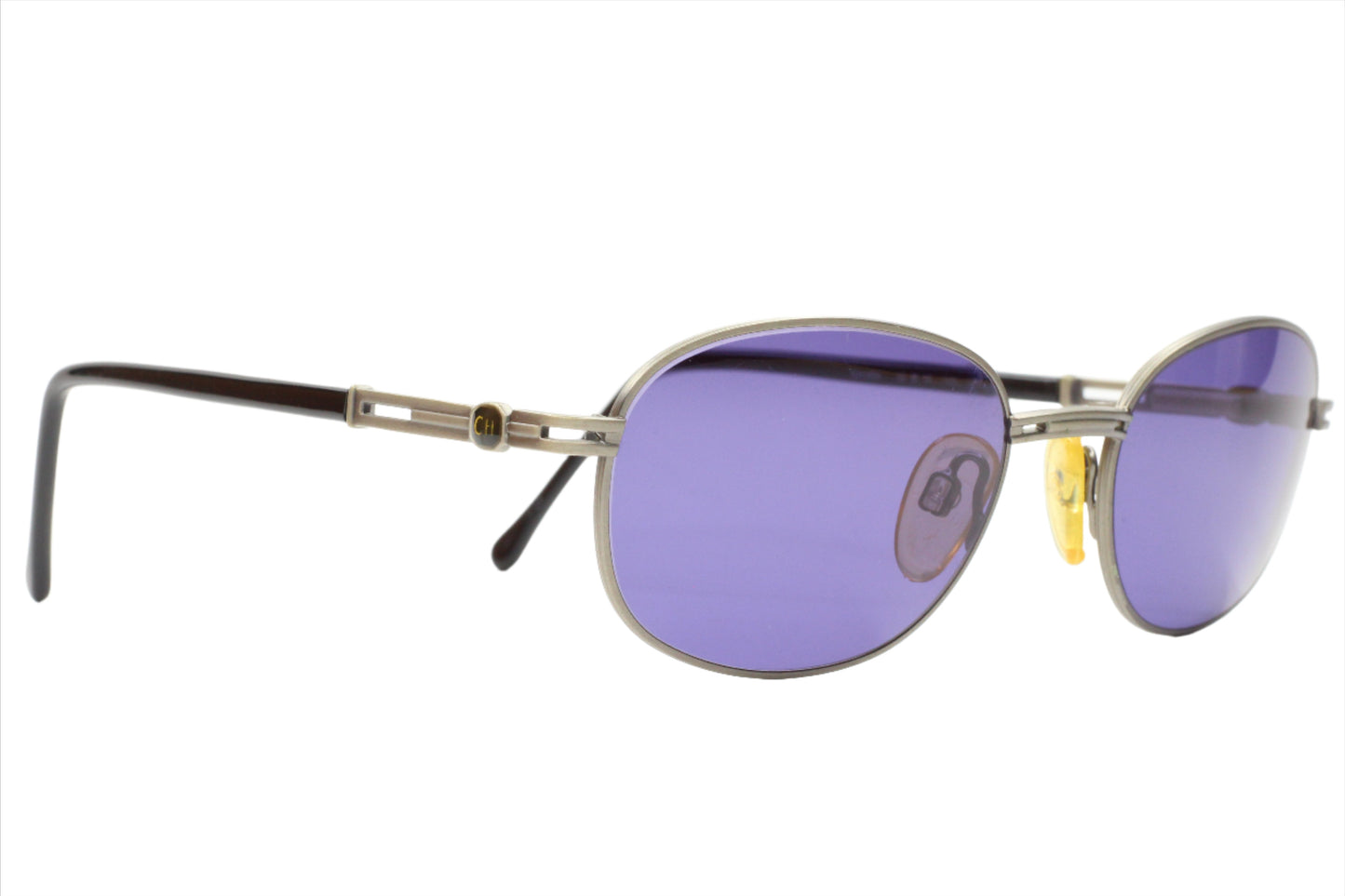 ABC Optical CH804 PD520 Carolina Herrera sunglasses with silver frame and purple lenses