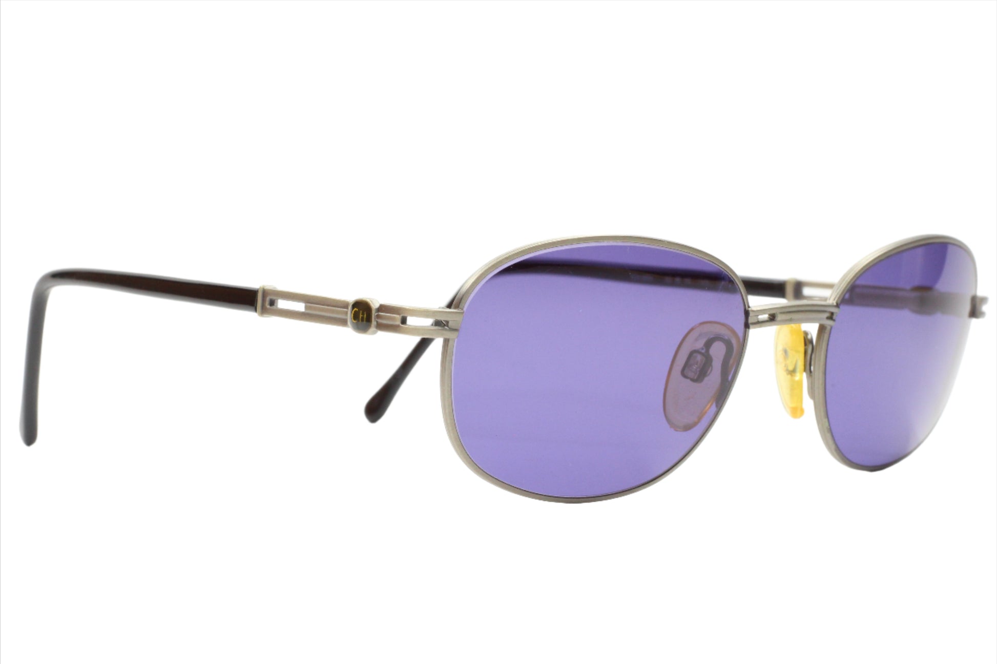 ABC Optical CH804 PD520 Carolina Herrera sunglasses with silver frame and purple lenses