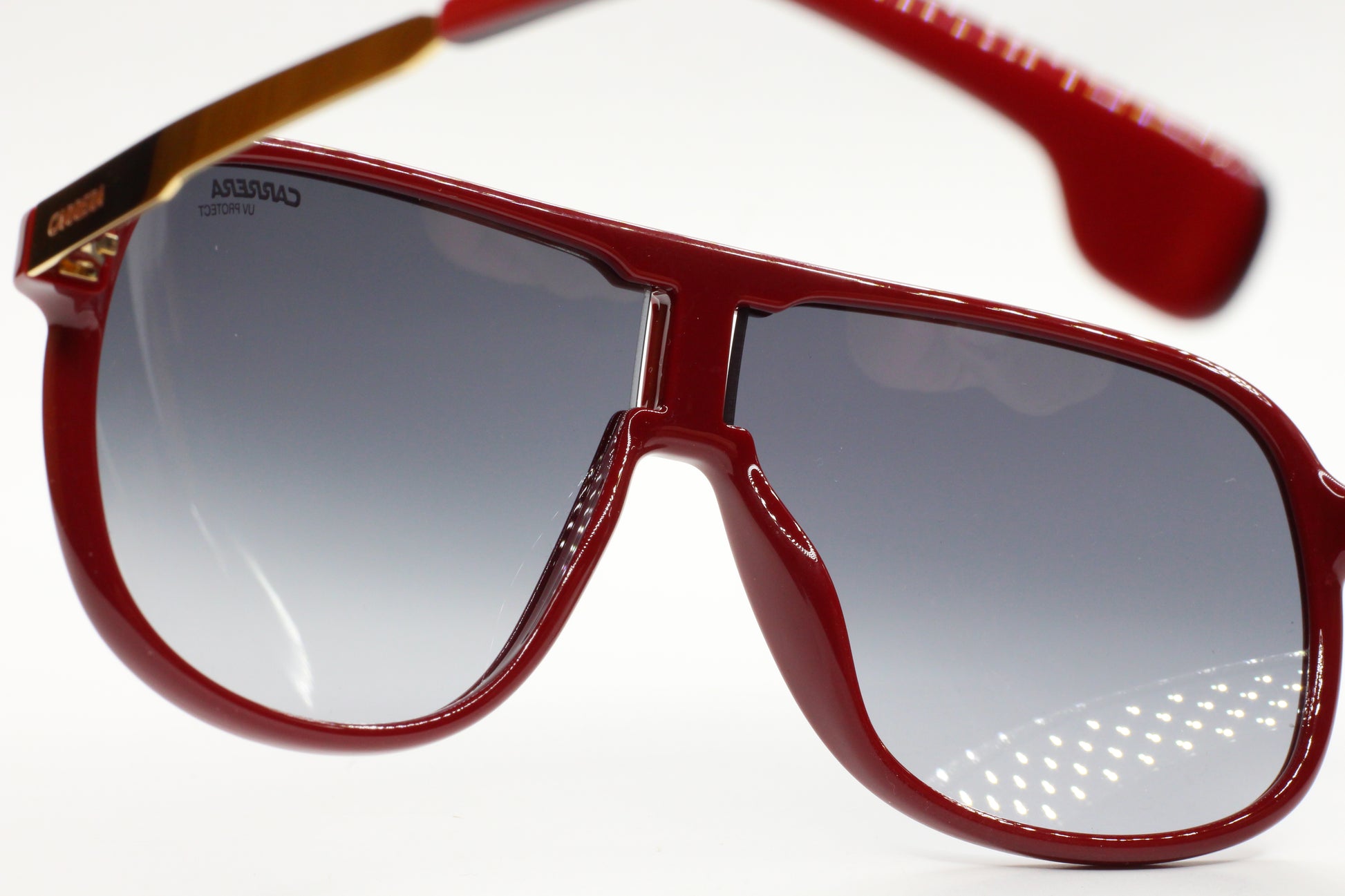 Red aviator style Carrera sunglasses by ABC Optical with gradient lenses and bold frame design