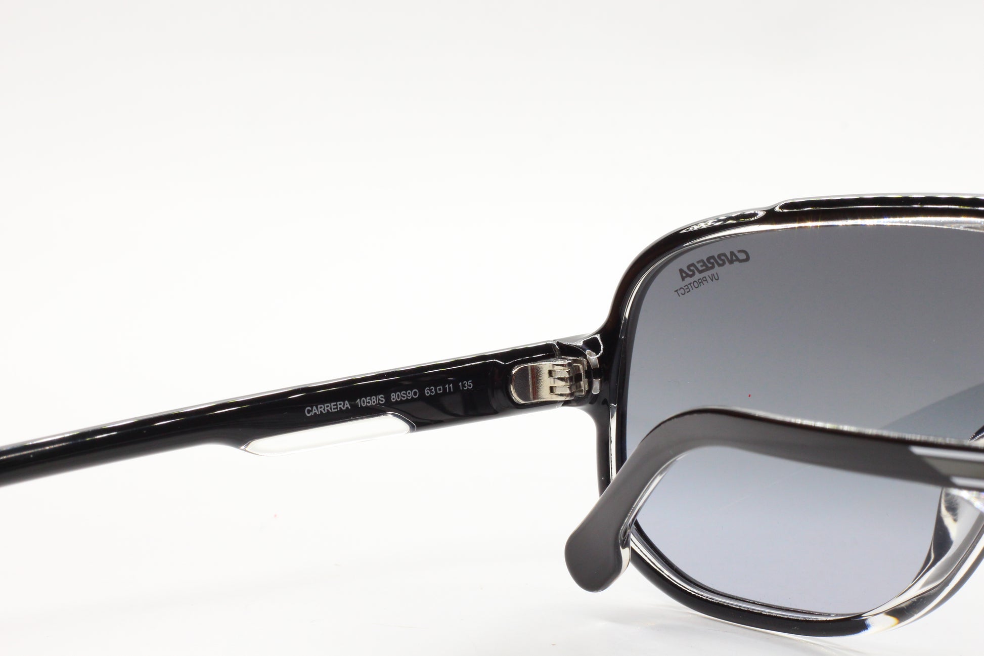 Close-up of ABC Optical Carrera sunglasses with black frames and gray lenses to buy Carrera designer shades online