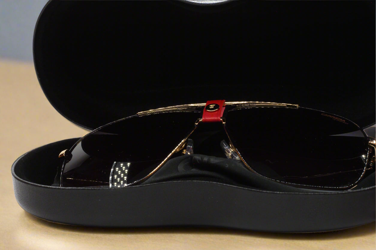 Black and gold Carrera sunglasses in a black protective case from ABC Optical buy Carrera sunglasses online