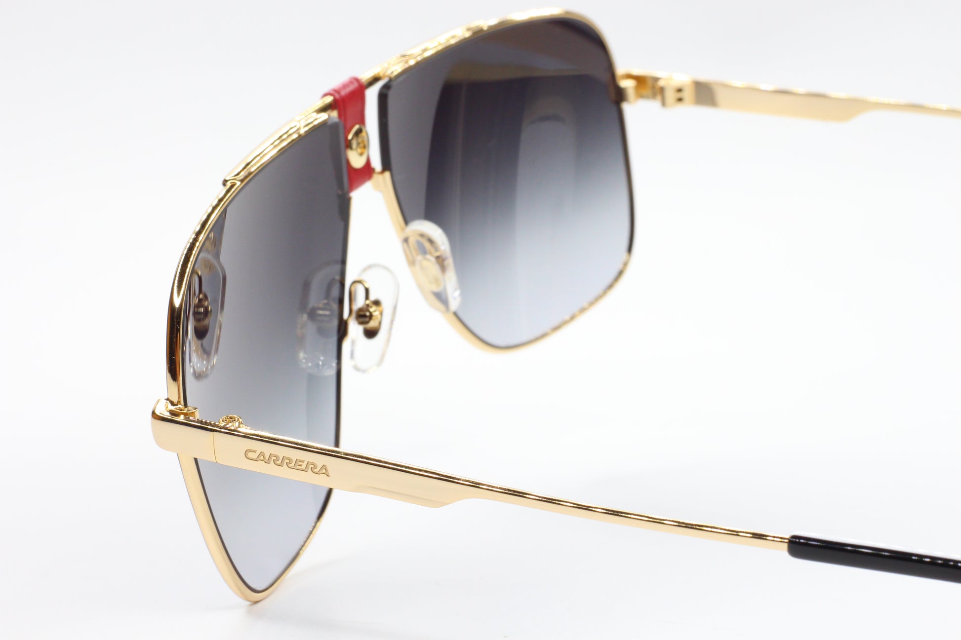 Gold Carrera sunglasses with gradient lenses and detailed frame design to buy Carrera sunglasses online from ABC Optical