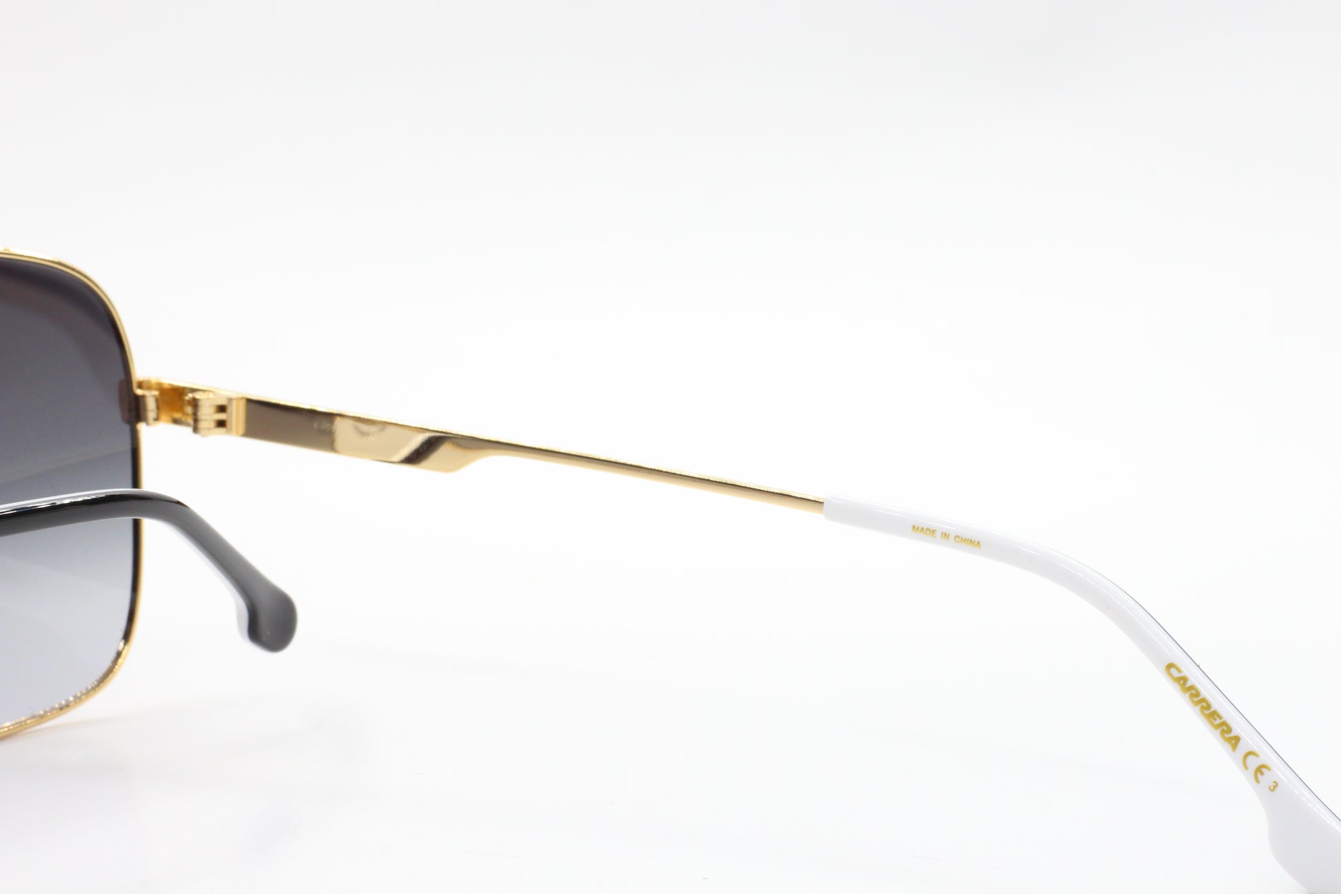 Close-up of ABC Optical gold and white Carrera sunglasses frame detail to buy Carrera sunglasses online
