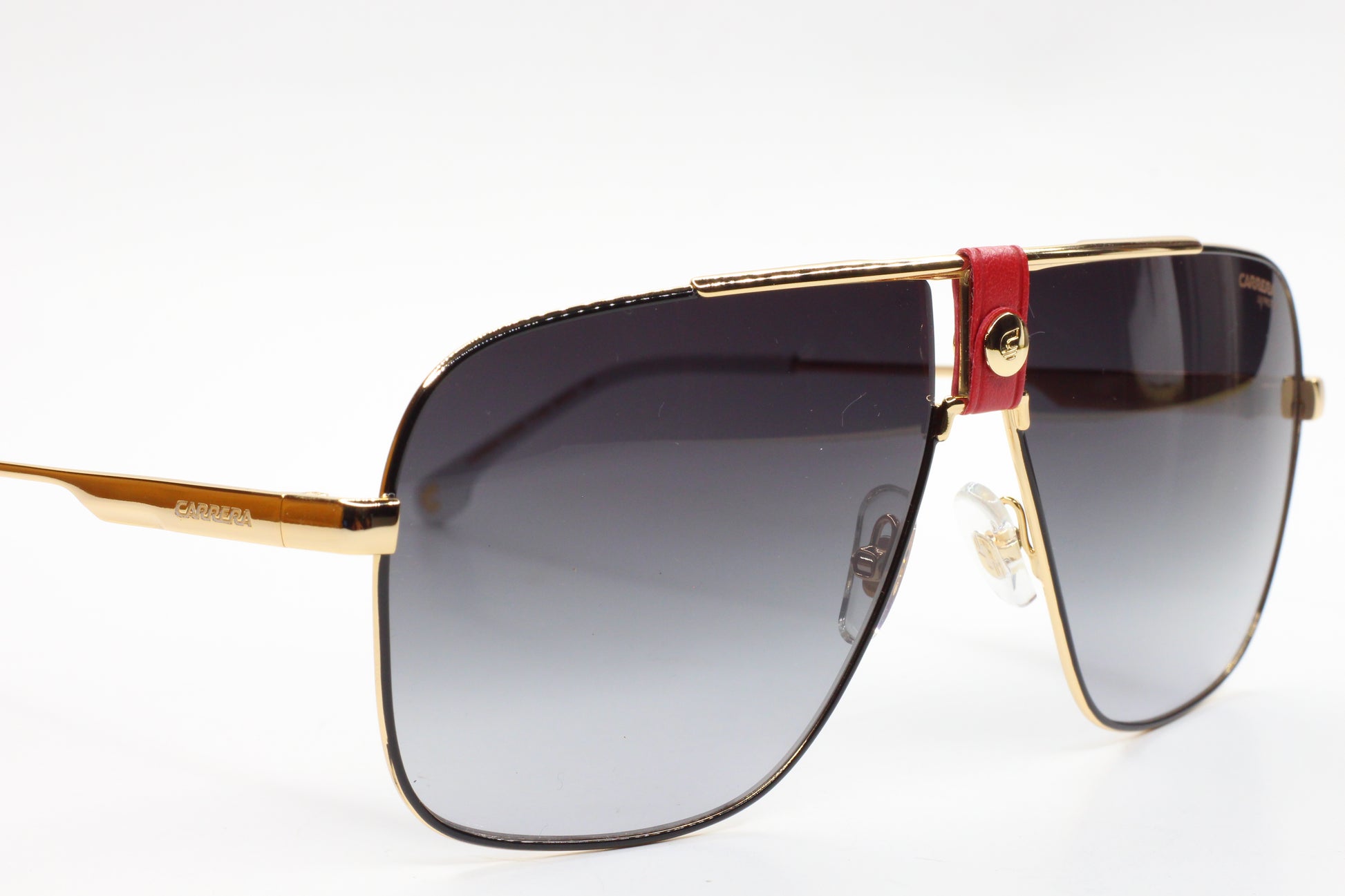 Gold framed Carrera sunglasses with gradient lenses and red detail to buy Carrera sunglasses online from ABC Optical