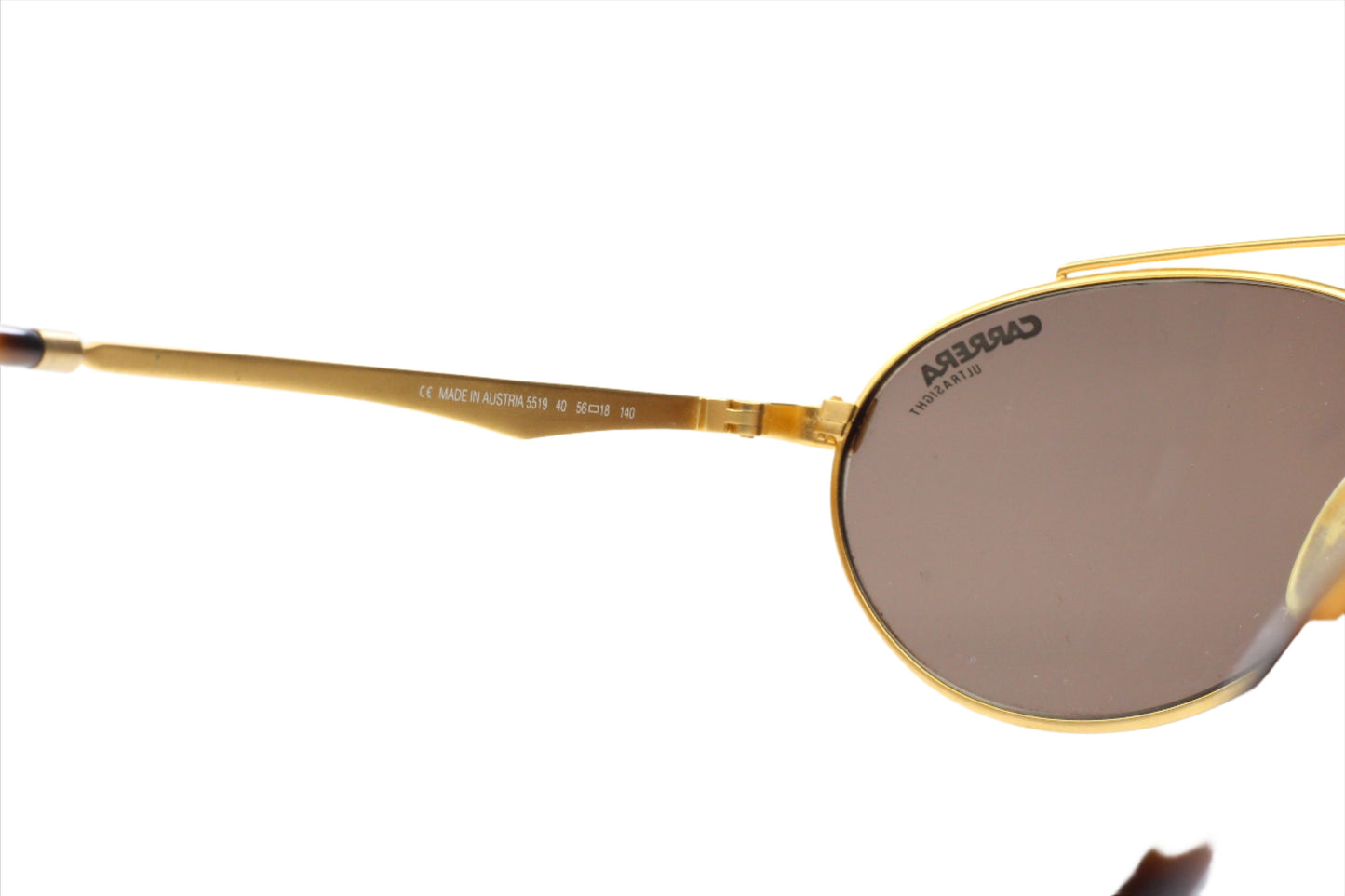 Close-up of gold metal frame and brown lenses of Carrera CA5519 vintage sunglasses by ABC Optical