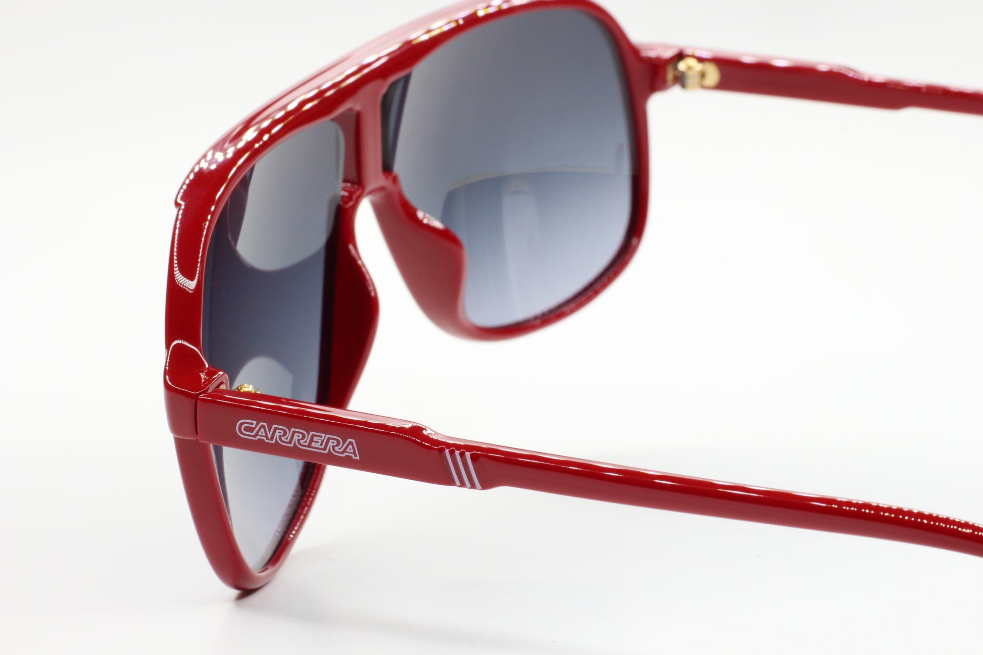 Red ABC Optical Carrera men's fashion eyewear with tinted lenses and sleek frame design