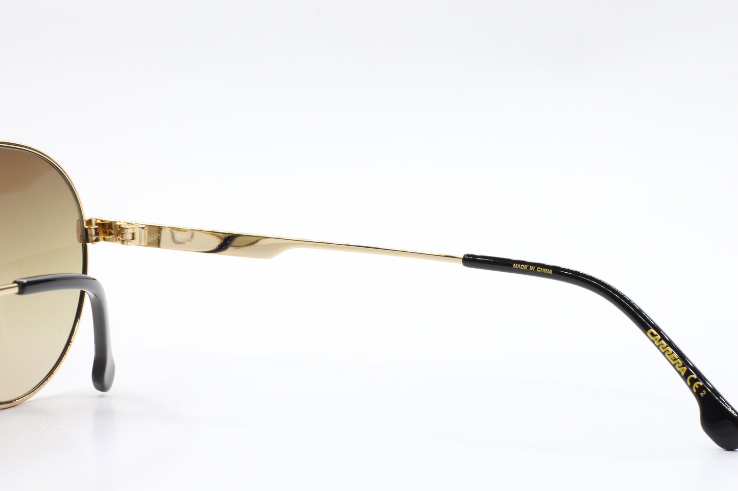 Close-up of ABC Optical gold and black premium Italian sunglasses online with detailed arm design