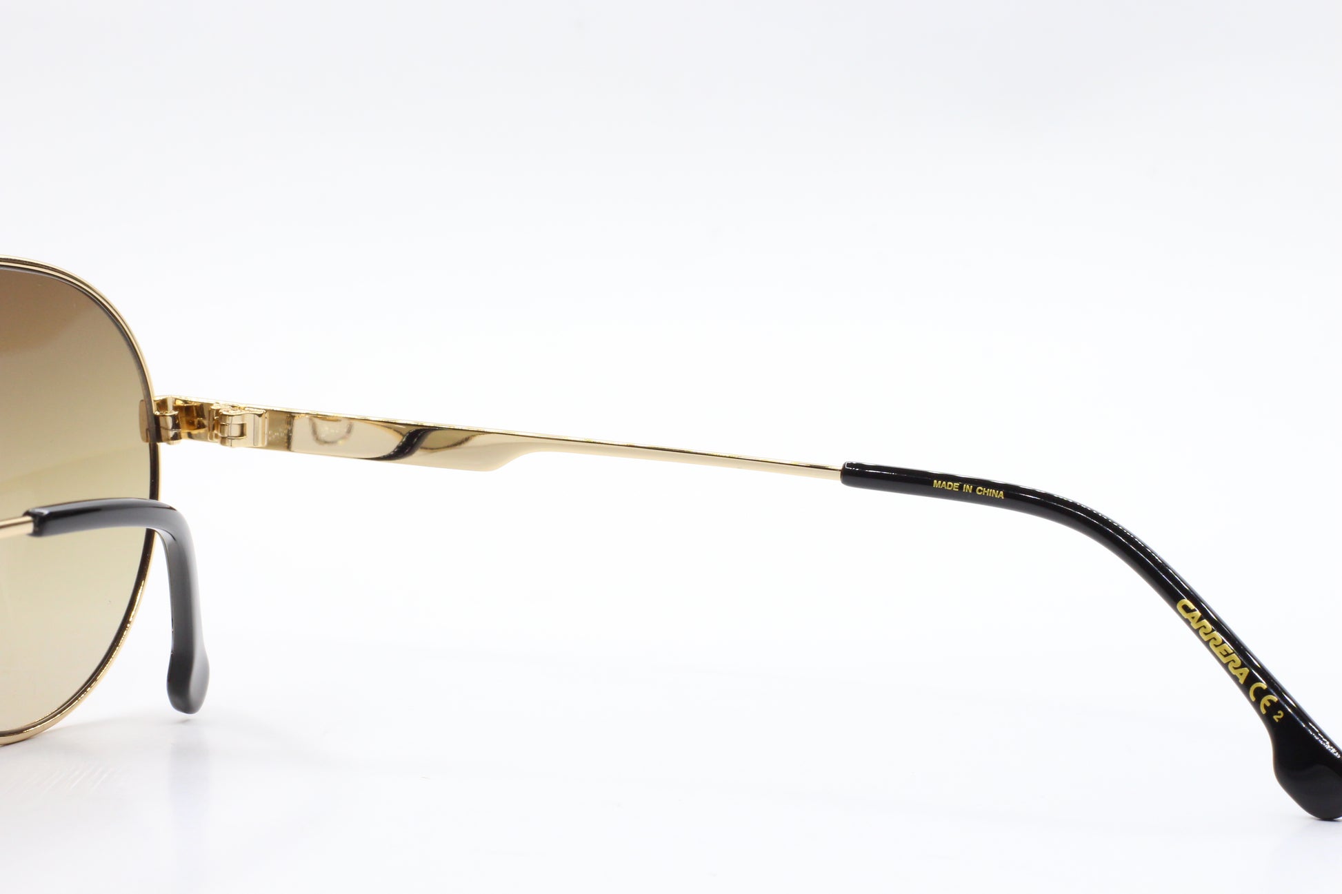 Close-up of ABC Optical gold and black premium Italian sunglasses online with detailed arm design