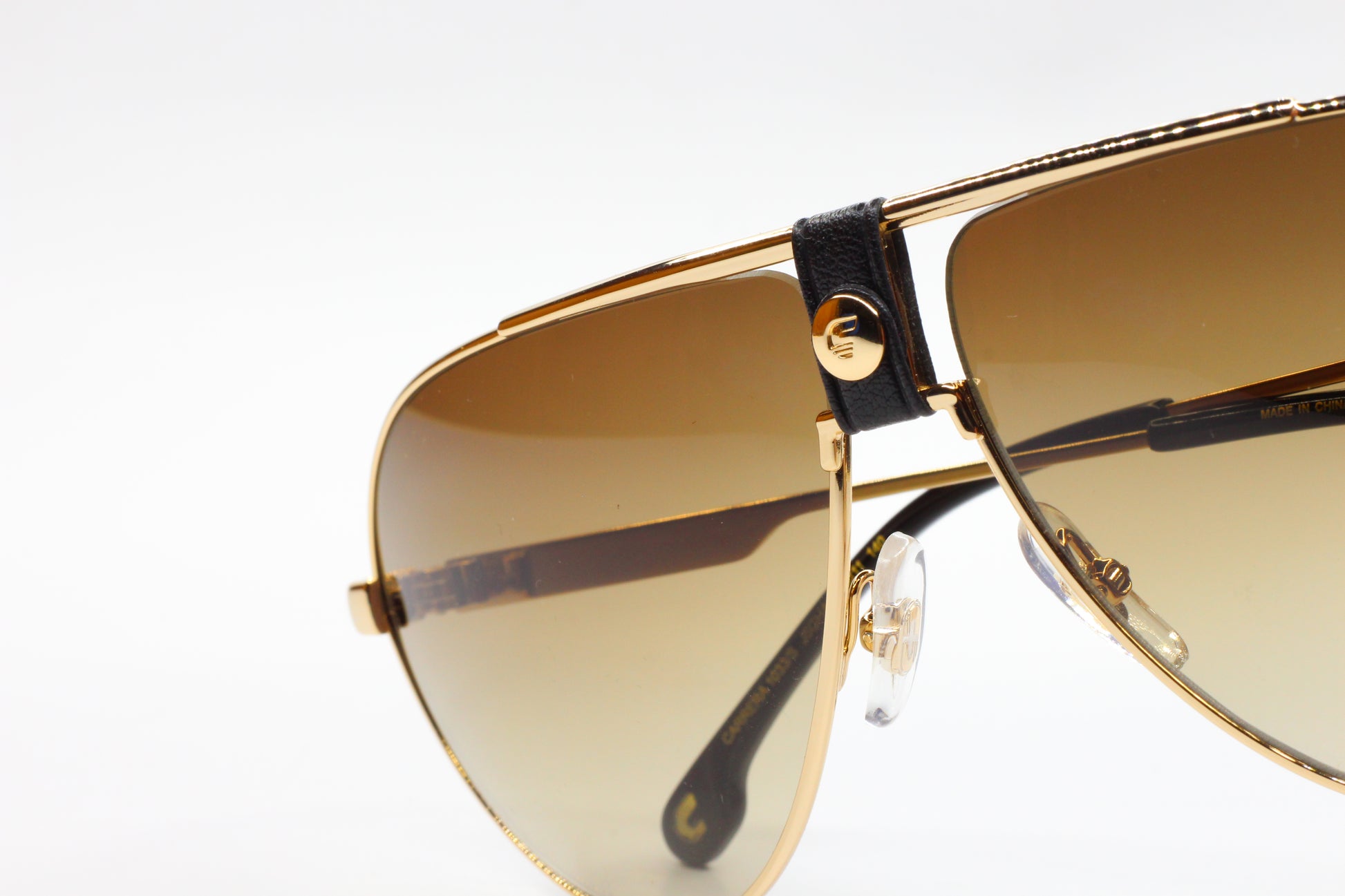 Premium Italian sunglasses online featuring gold and black aviator optical frames by ABC Optical