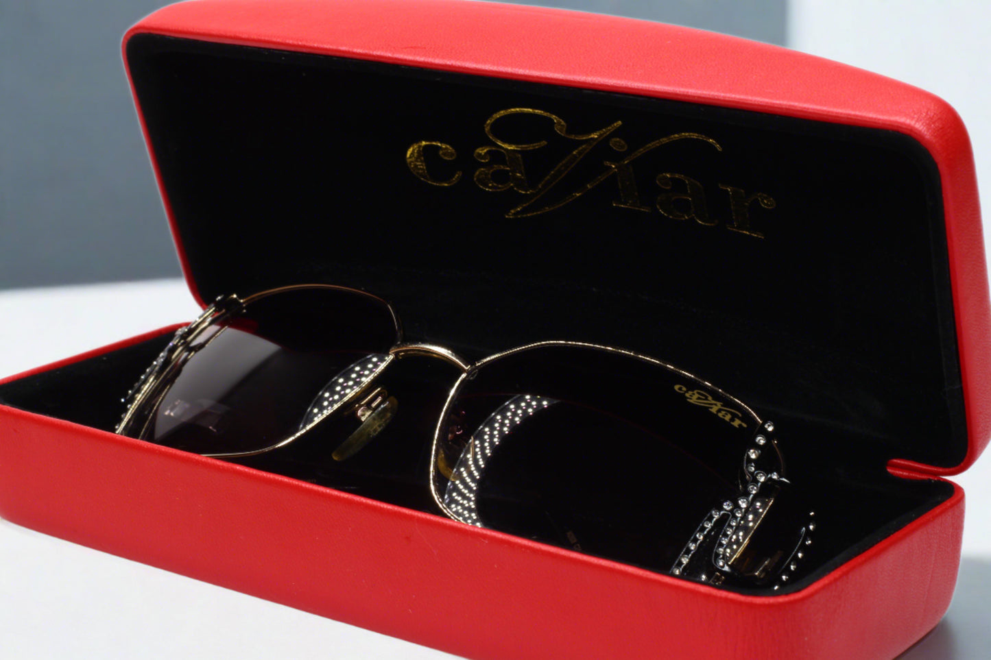 Caviar M2608 Austrian crystal sunglasses displayed in red case by ABC Optical