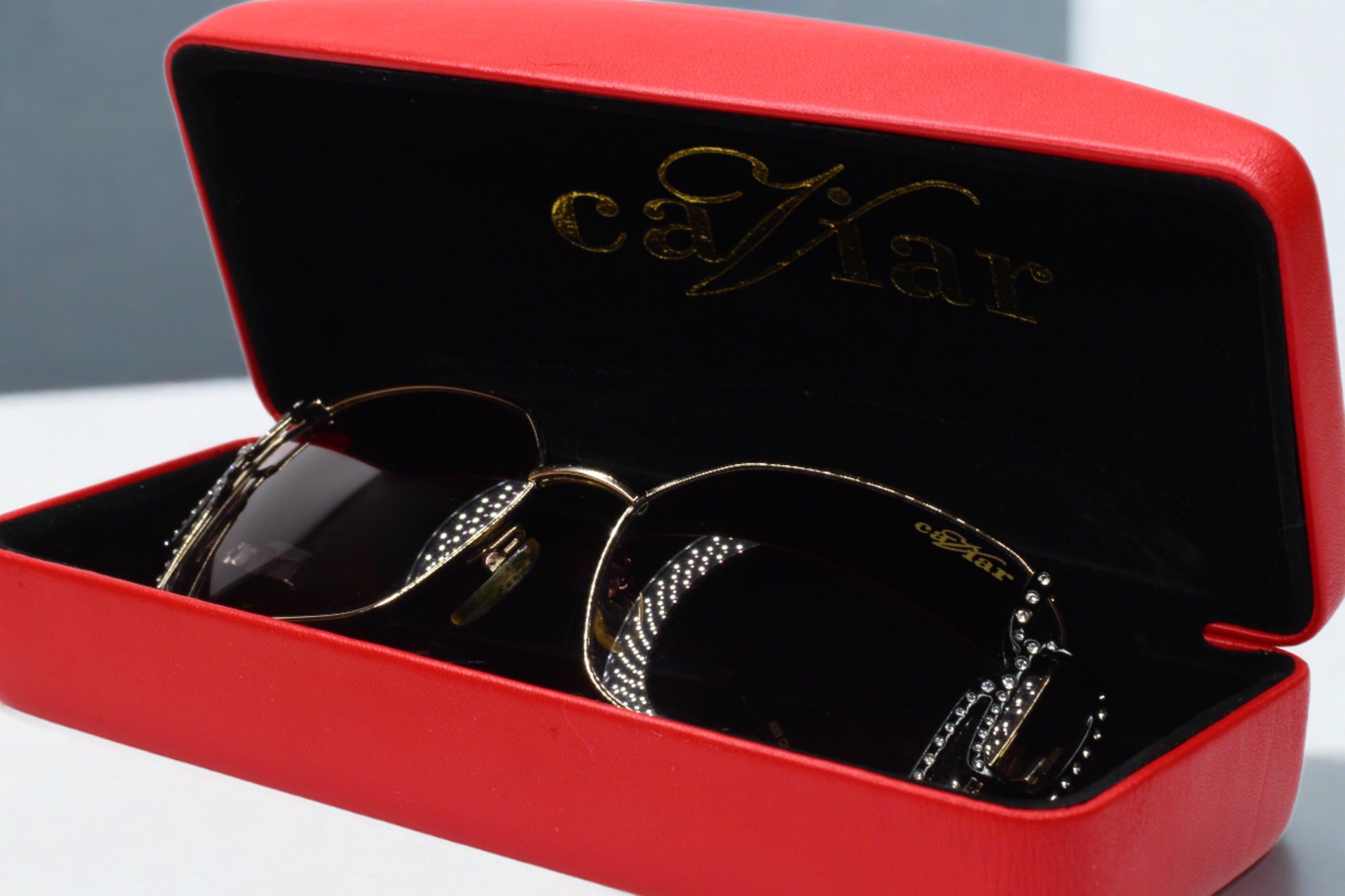 Caviar M2608 Austrian crystal sunglasses displayed in red case by ABC Optical