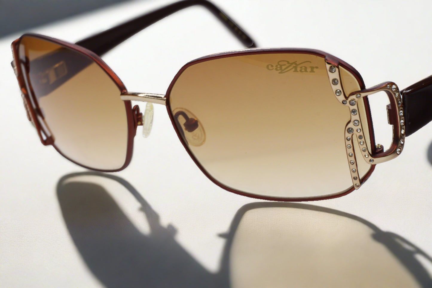 Caviar M2608 gold brown sunglasses by ABC Optical featuring rectangular lenses and decorative side details