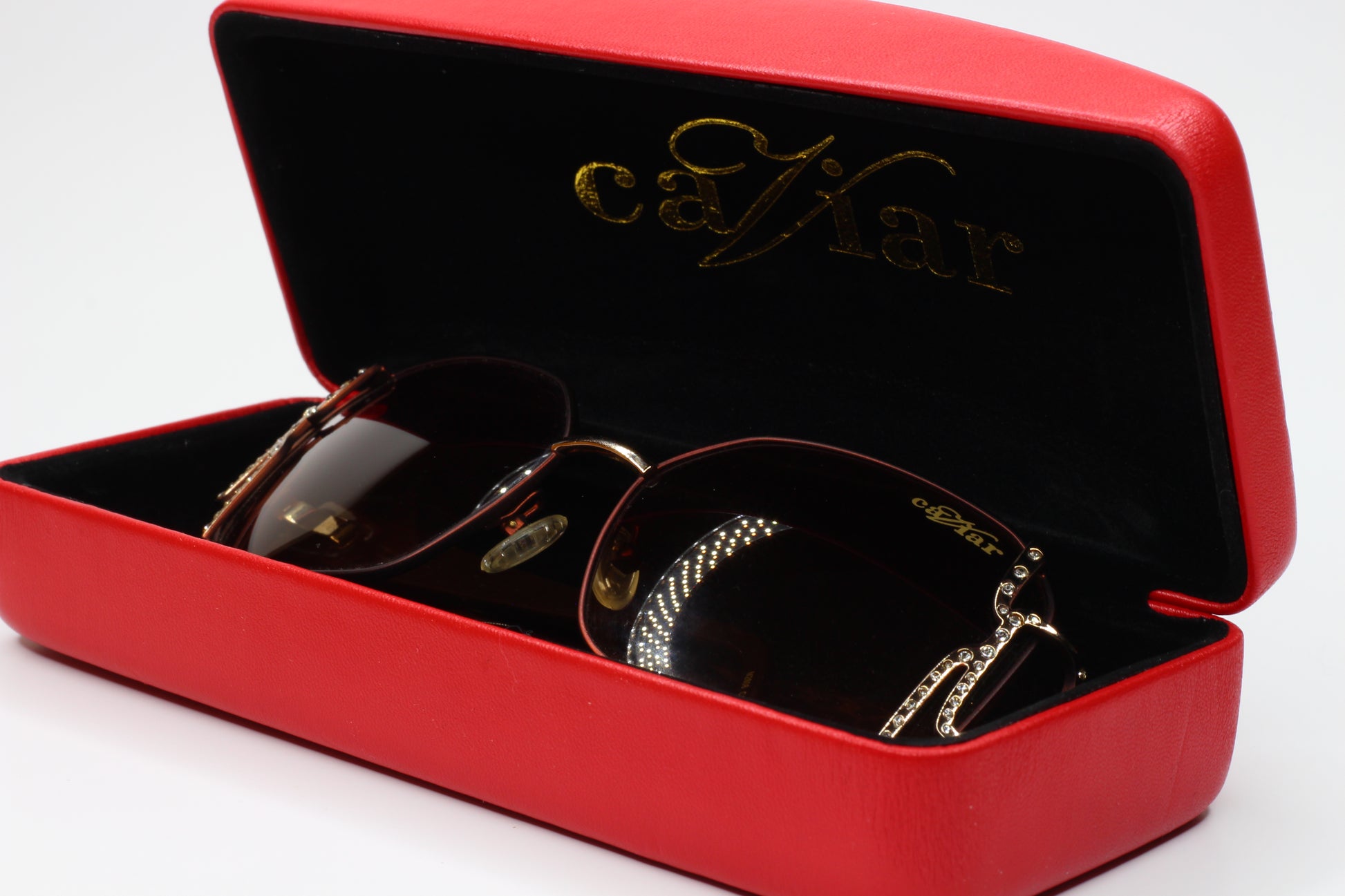 Caviar M2608 gold brown sunglasses in a red case from ABC Optical with detailed frame design