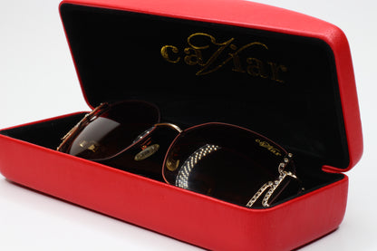 Caviar M2608 gold brown sunglasses in a red case from ABC Optical with detailed frame design