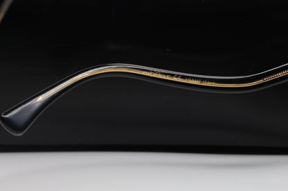 Close-up side view of ABC Optical Caviar M3002 Swarovski sunglasses frame arm with gold detailing