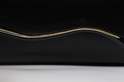 Close-up view of the gold and black frame arm of Caviar M3002 Swarovski sunglasses from ABC Optical
