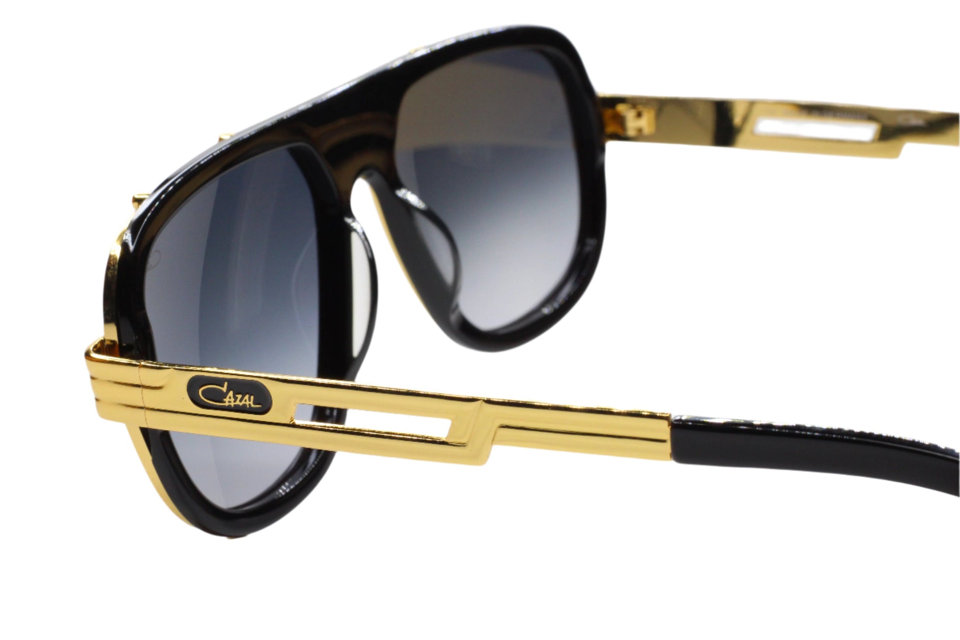 Cazal 665 sunglasses black gold with thick black frame and gold metal arms from ABC Optical
