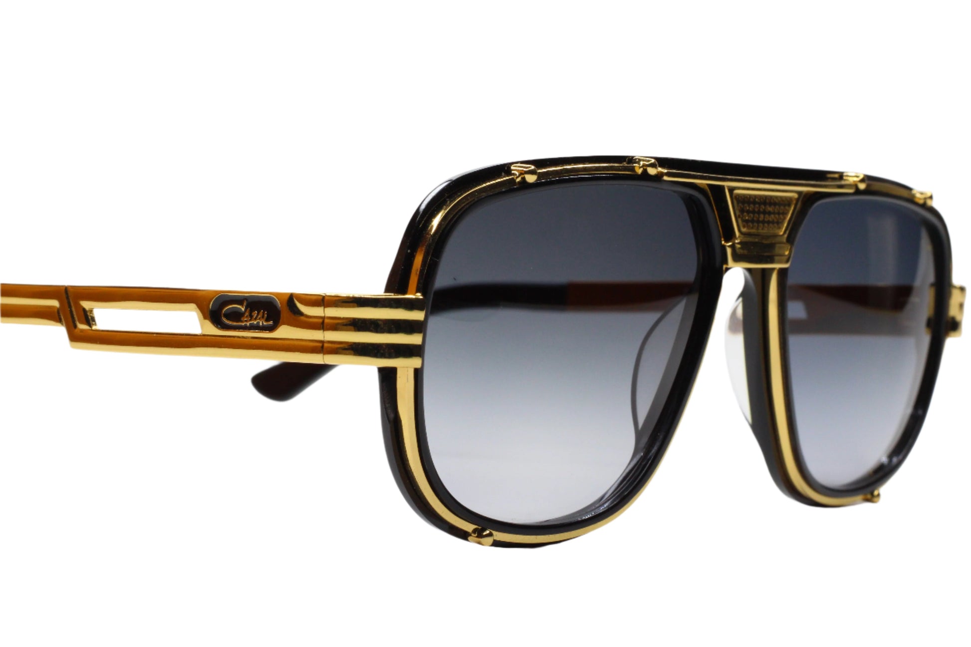 Cazal 665 sunglasses black gold with bold black and gold frame and gradient lenses by ABC Optical
