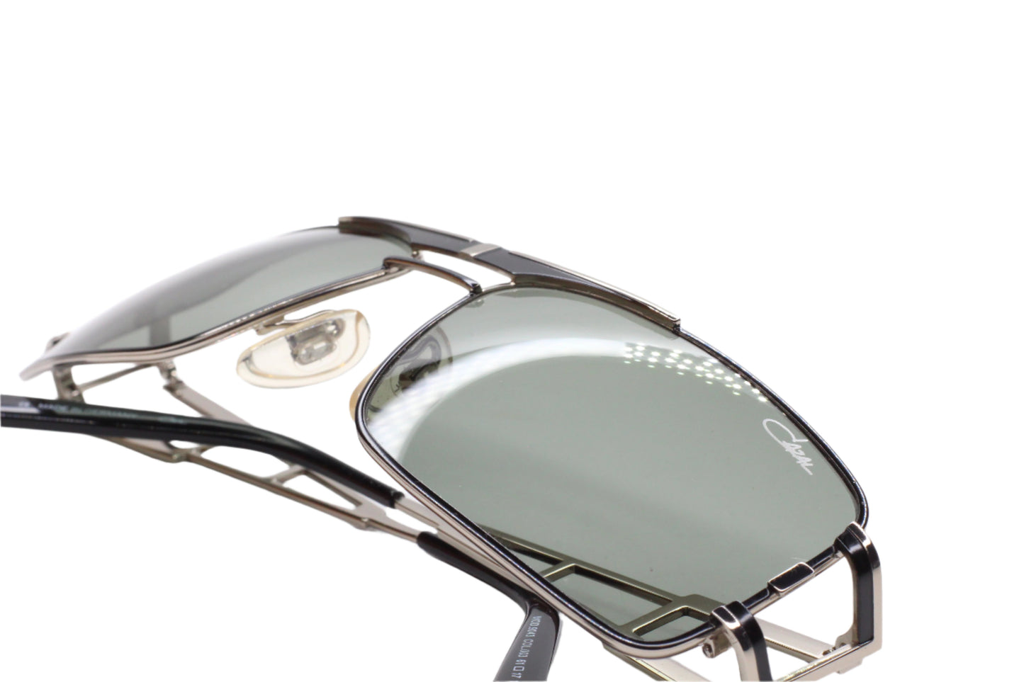 Close-up of Cazal 9043 black silver sunglasses by ABC Optical with sleek metal frame and tinted lenses