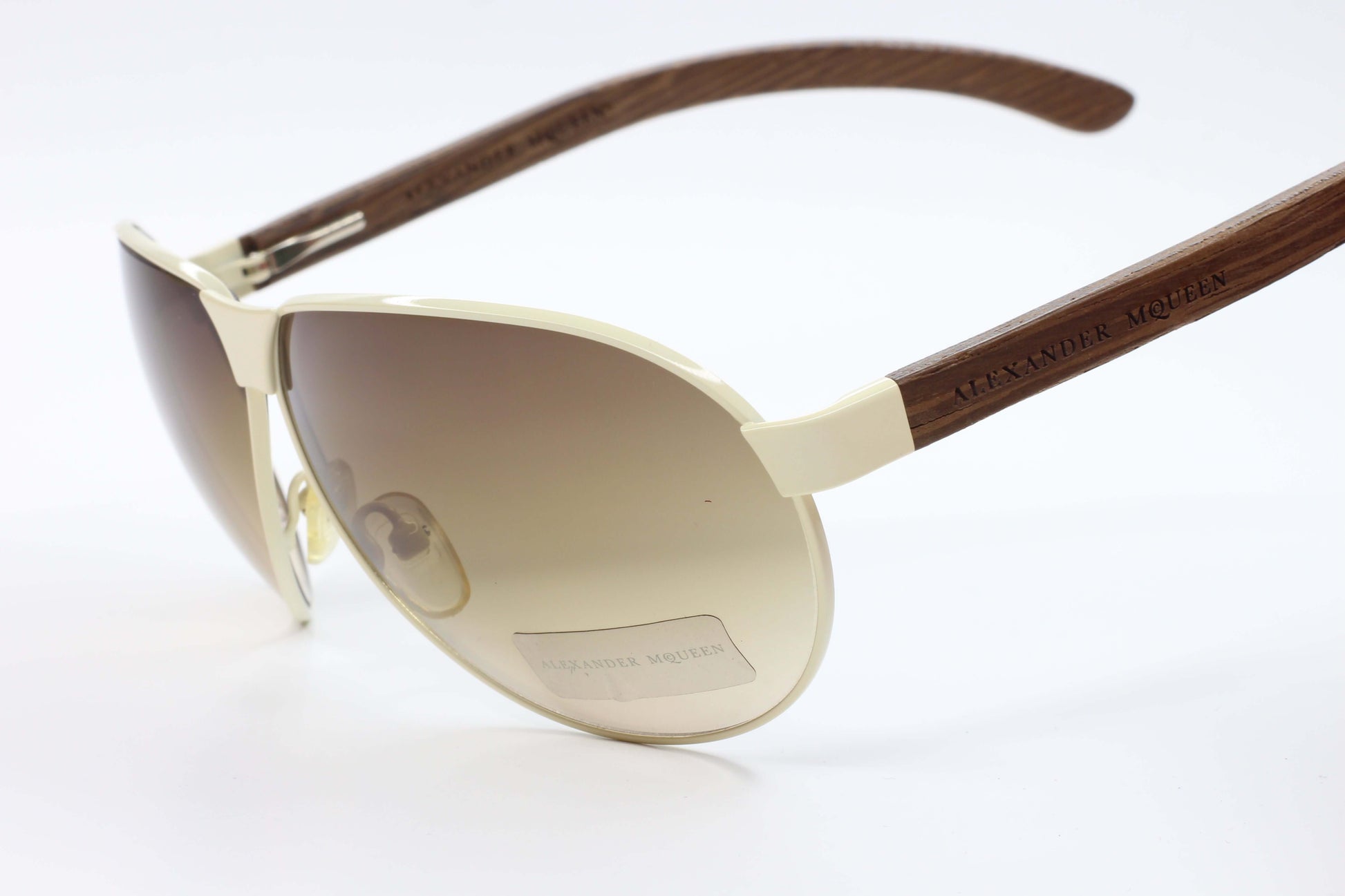 Designer Alexander McQueen AMQ4049S eyewear with brown gradient lenses and wood-textured temples