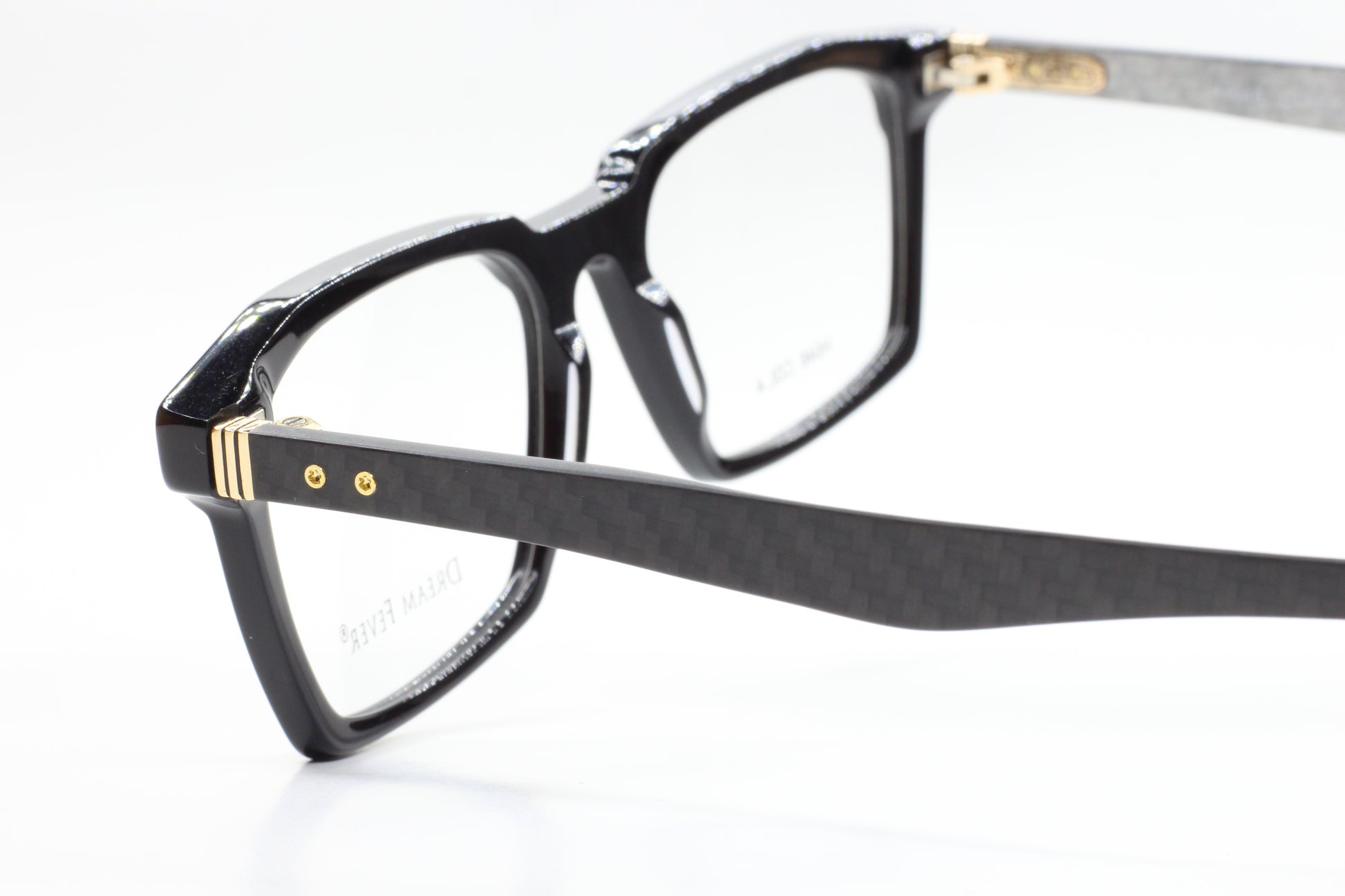 ABC Optical Dream Fever designer eyeglass frames in black with gold accents and sleek rectangular shape