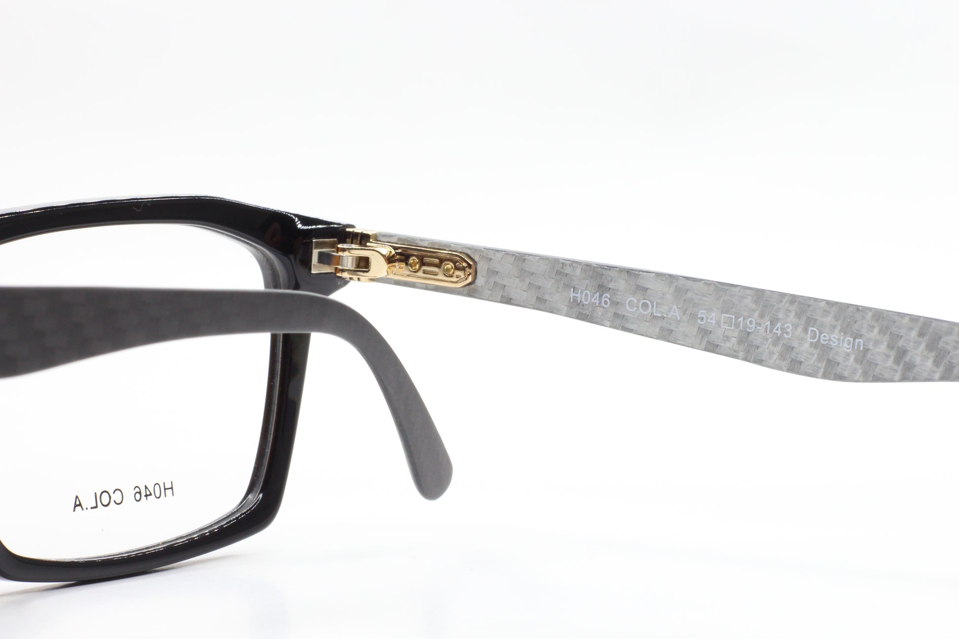 Close-up of ABC Optical Dream Fever designer eyeglass frames with black and gray textured temples